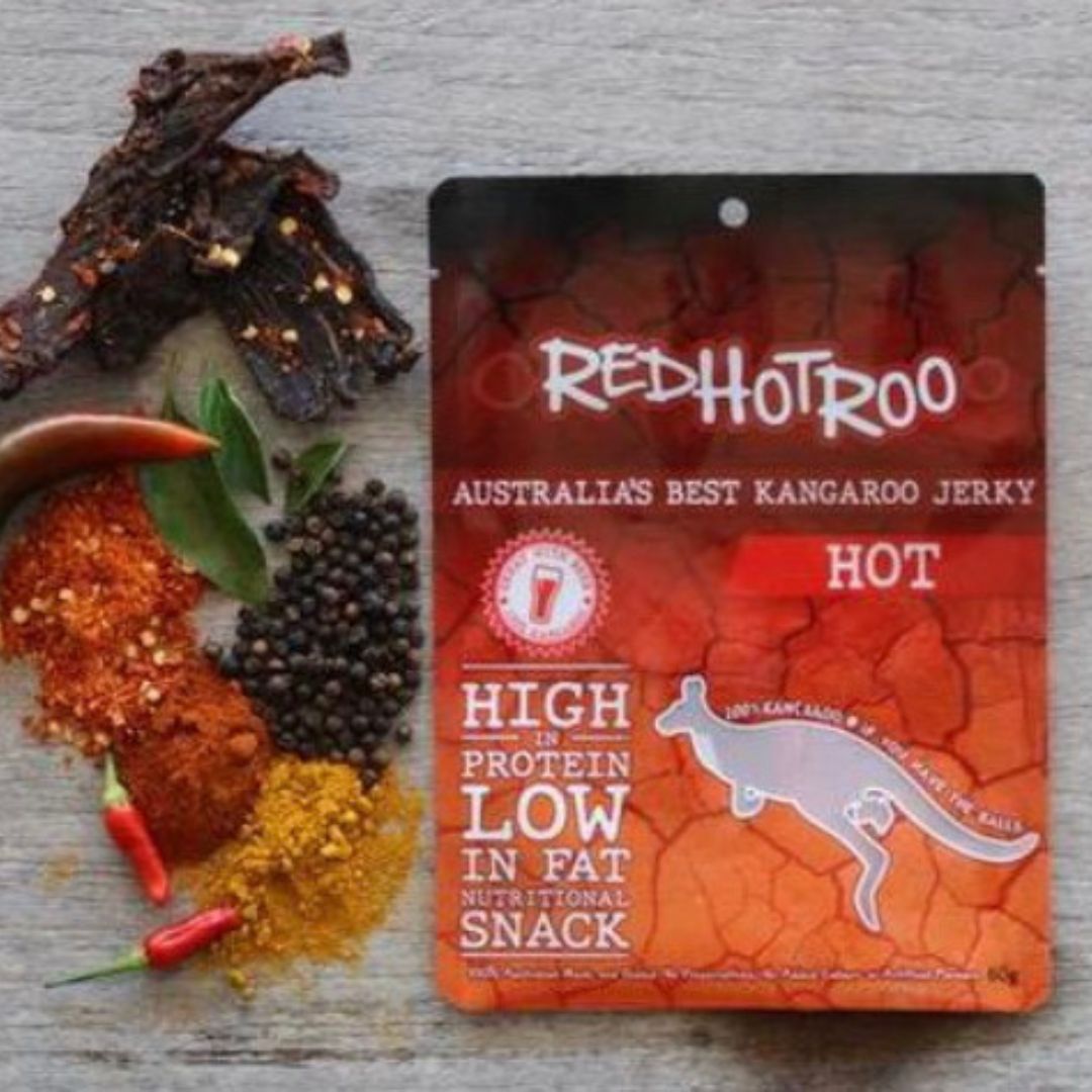 Chilli Kangaroo Jerky in packaging next to piles of spices