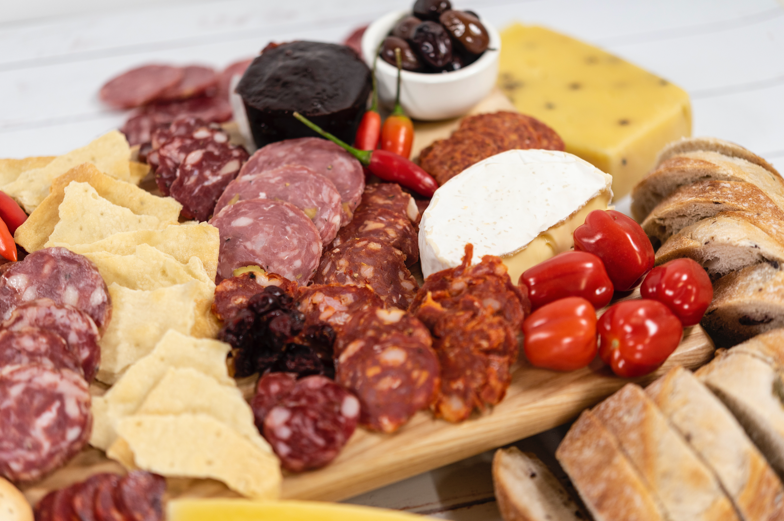 Grazing board featuring artisan delish salami's italian-style salami products