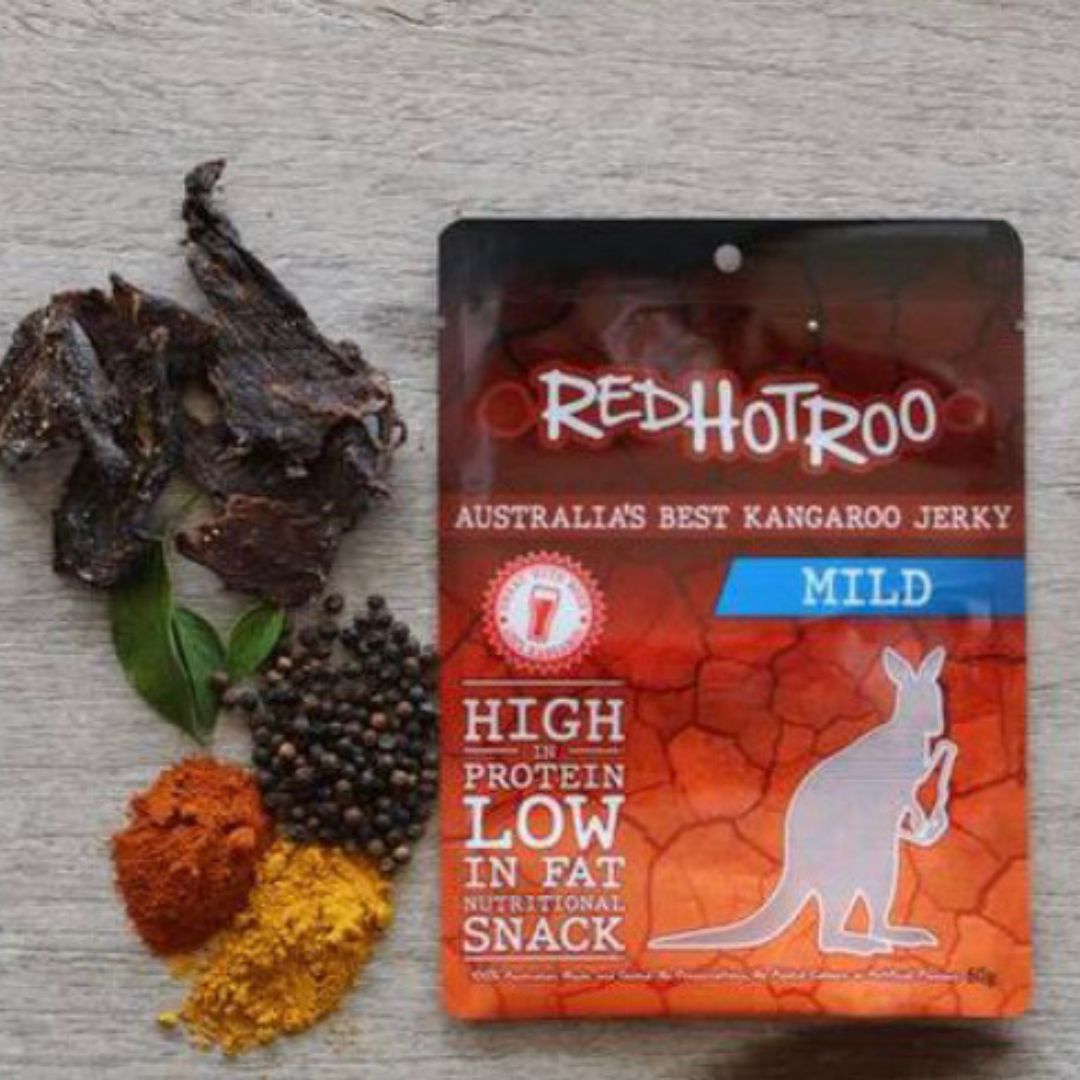 Red Hot Roo Mild Kanagaroo Jerky in packaging next to a pile of miscellaneous spices